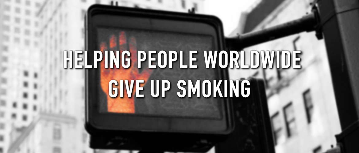 A red light on a stop sign with the caption helping people worldwide give up smoking