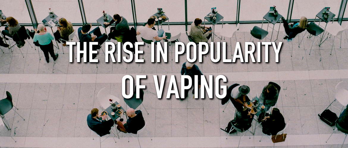 Image of a crowd of people on a lunch break, with the title The Rise in Popularity of Vaping
