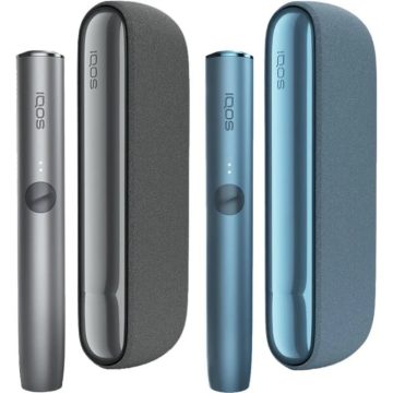 Two IQOS ILUMA heated tobacco kits in grey and blue next to their charging holders on a white background